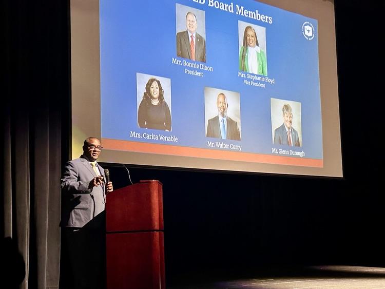 JEFCOED Superintendent Dr. Walter Gonsoulin speaks into a microphone in an auditorium