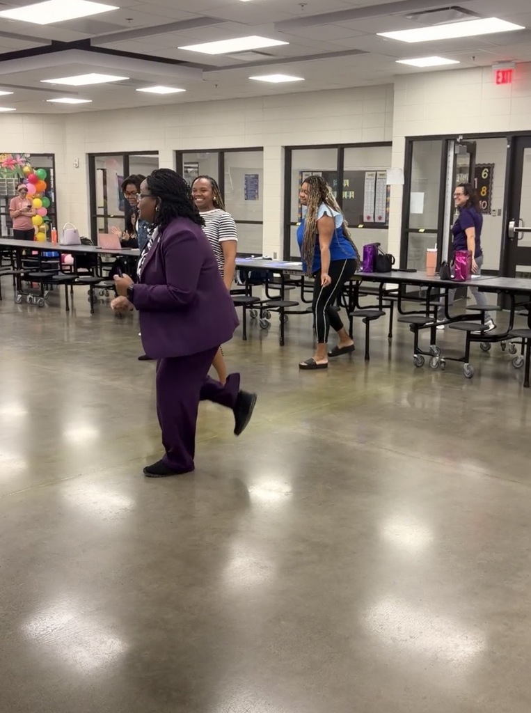 Teachers and Principal dancing