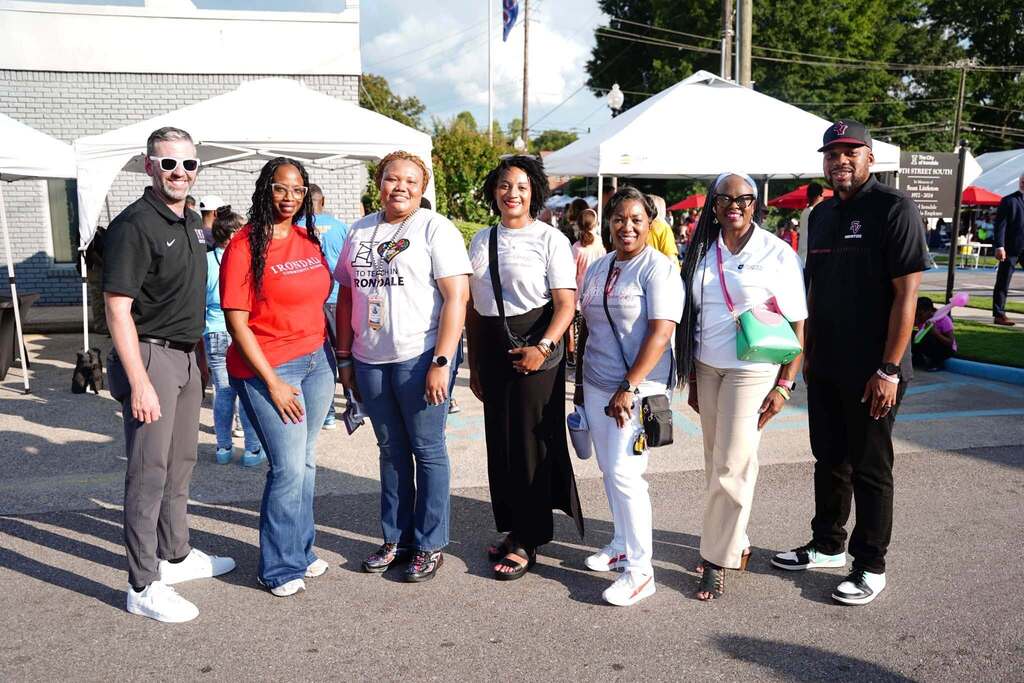 Administrators from Irondale schools stand together outdoors for a photo.