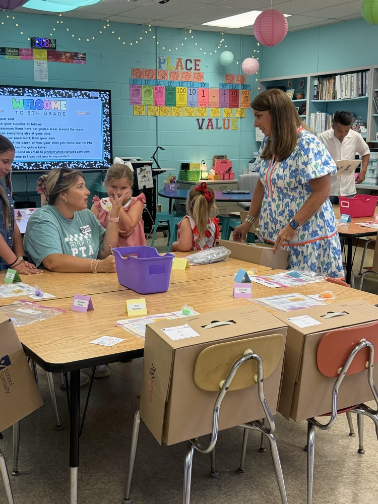 a parent talking with a teacher