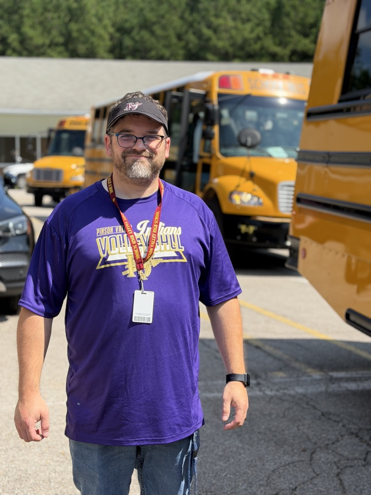 a PVHS teacher beside a bus