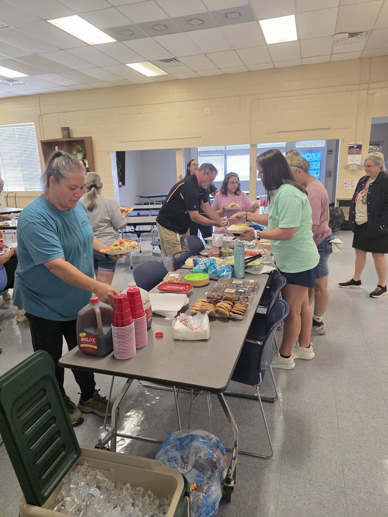 Faculty and staff members making lunch plates