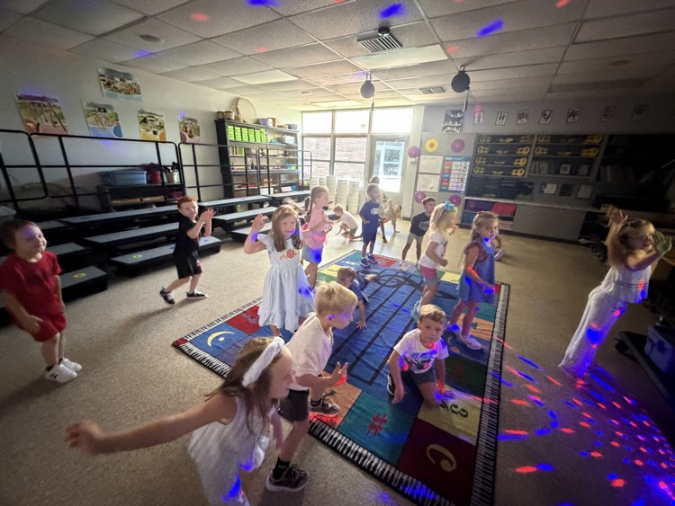 Children dancing with disco lights