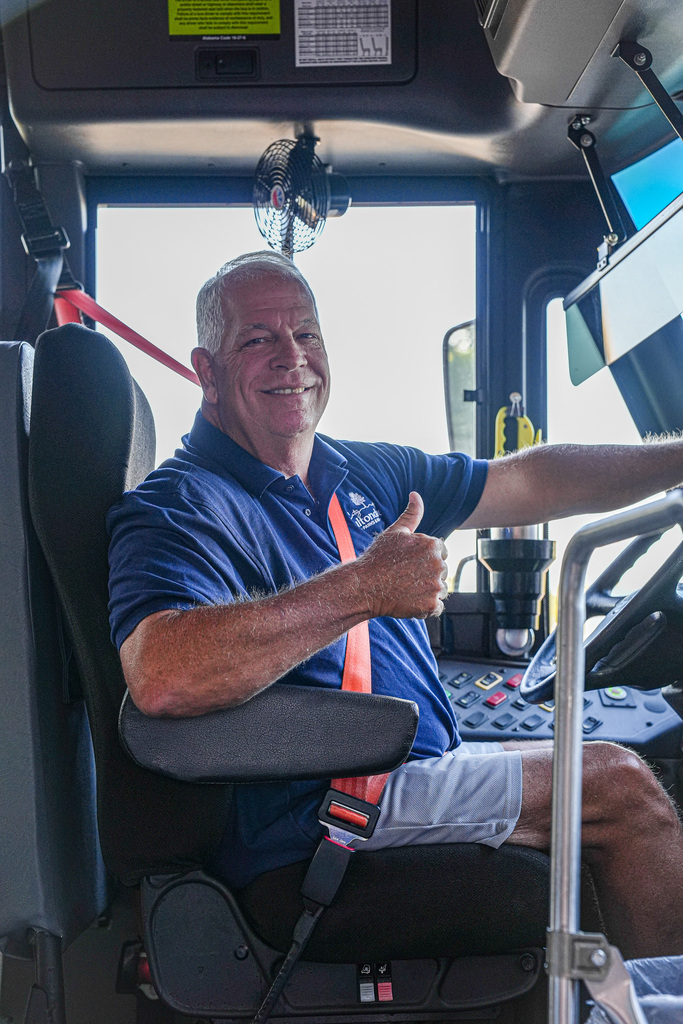 A bus driver smiles and gives the thumbs up sign as he drop off students at Fultondale Elementary on the first day of school.