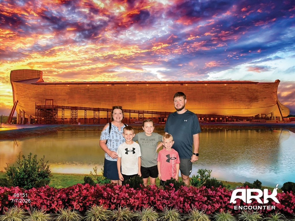 A family poses for a photo in front of a backdrop of Noah's Ark.