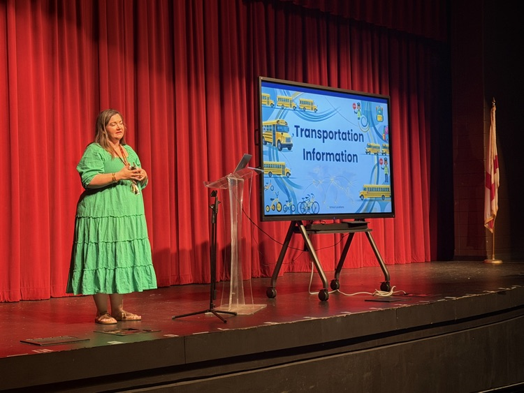 a counselor presents information from the stage