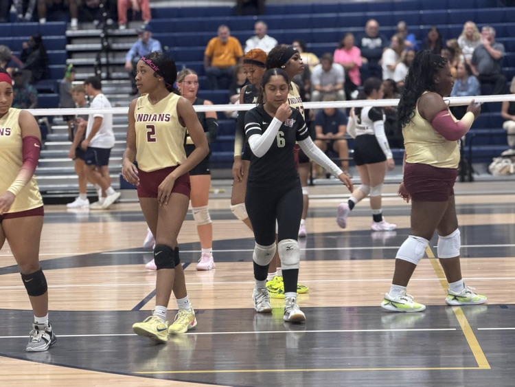 the varsity team walks onto the court