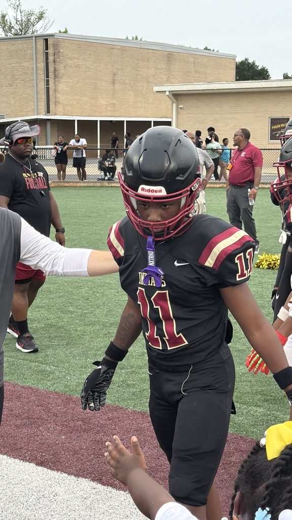 a coach encourages a football player
