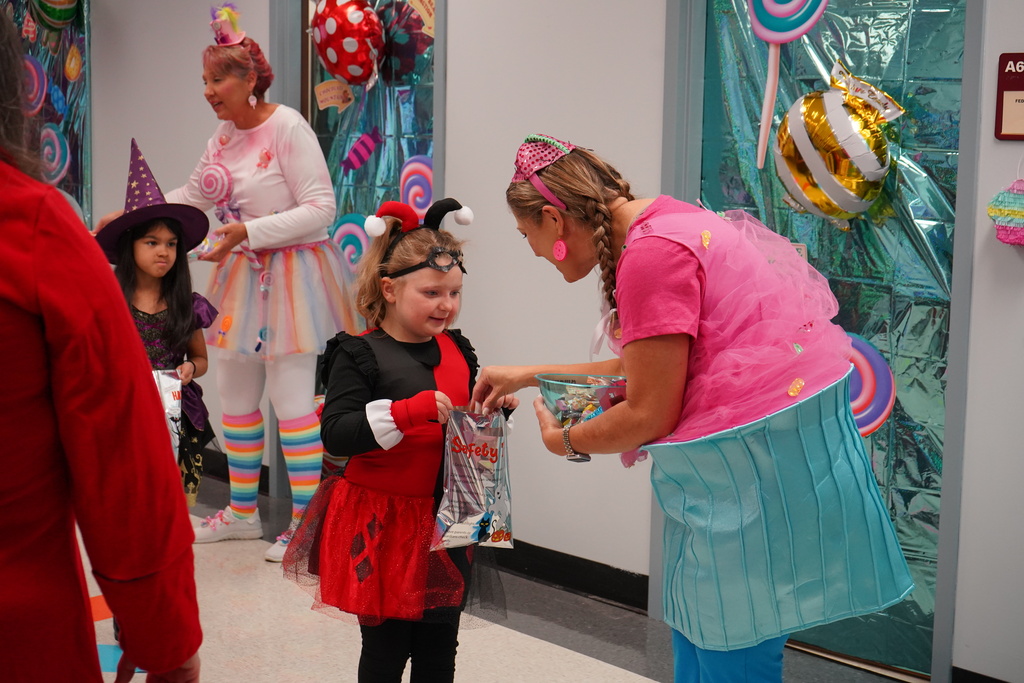 Students dressed in halloween costumes trick or treating