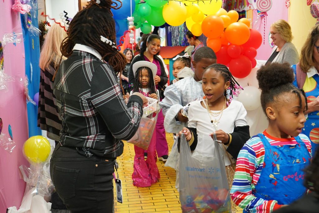Students dressed in halloween costumes trick or treating