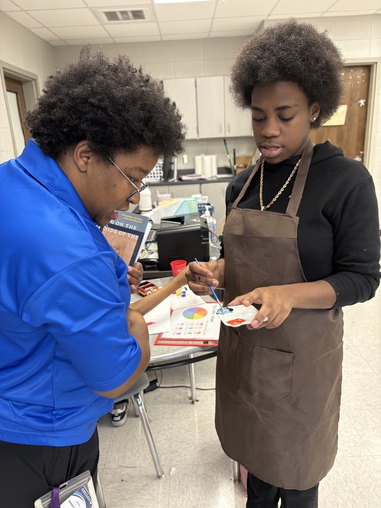 Ms. Dancer teaching art