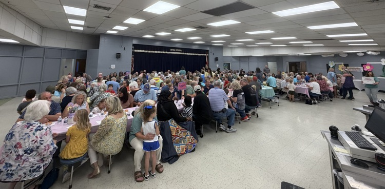 lunchroom full of grandparents and kindergarten students
