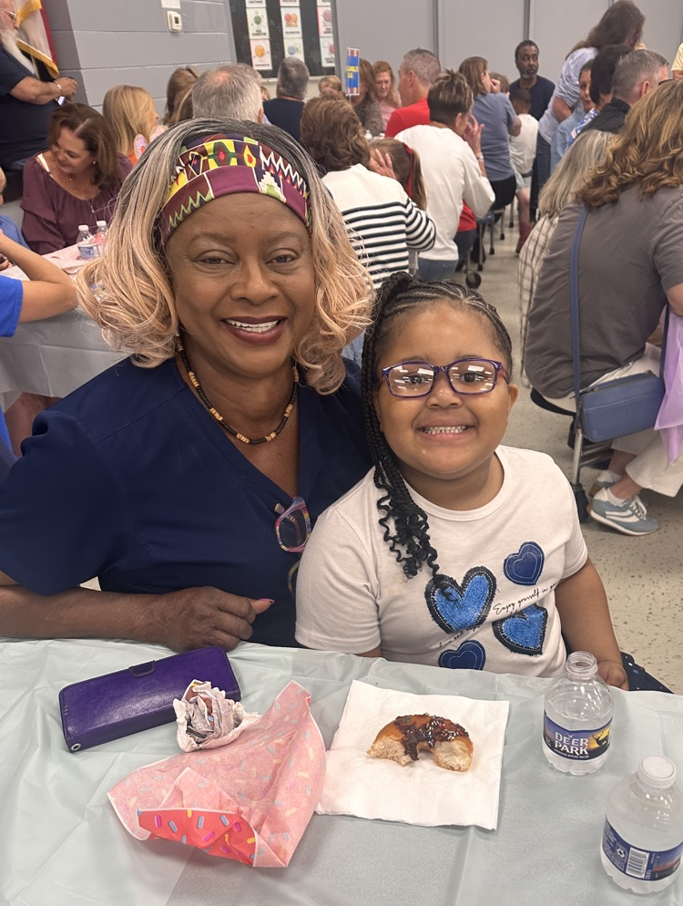 Grandmother and granddaughter smiling 