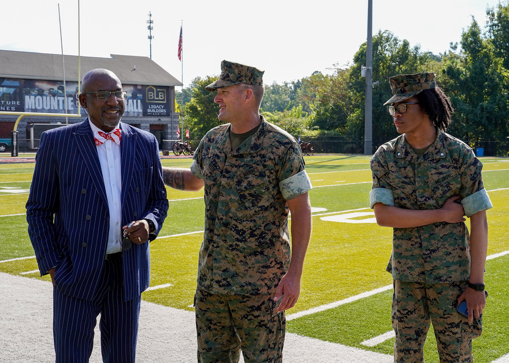 The mayor of Irondale speaks to JROTC members on a football field.