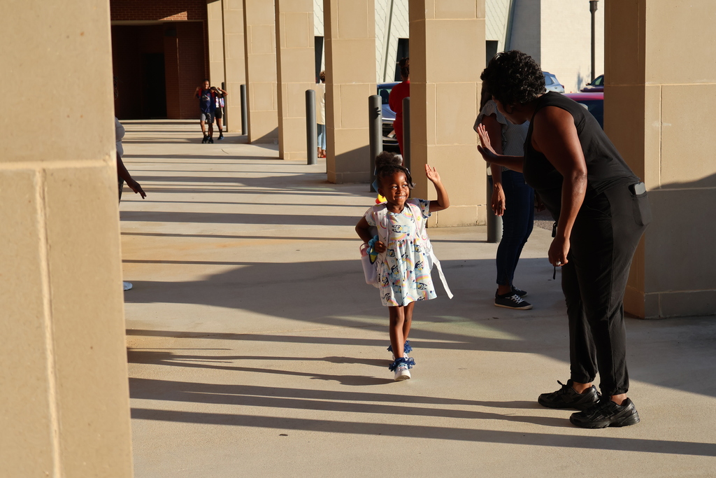 Grandparents greeting students in the morning carline