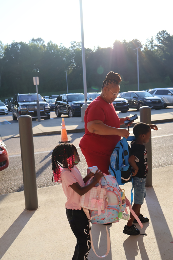 Grandparents greeting students in the morning carline