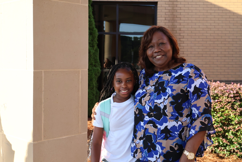 Grandparents greeting students in the morning carline