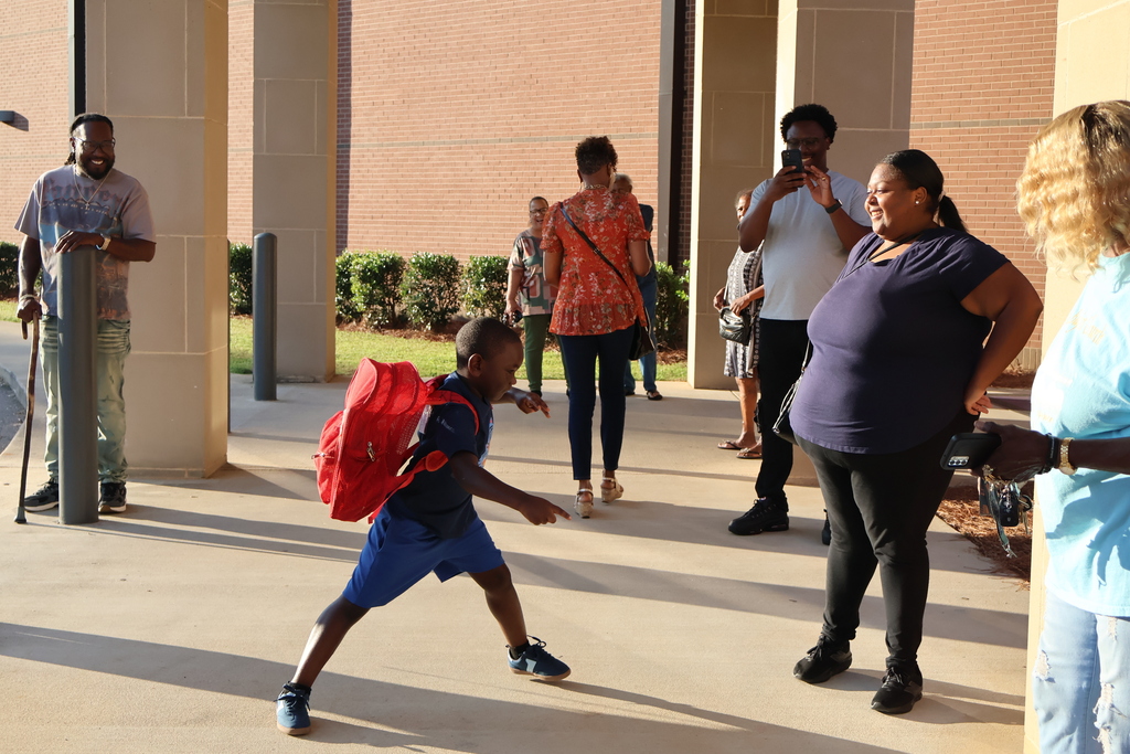Grandparents greeting students in the morning carline