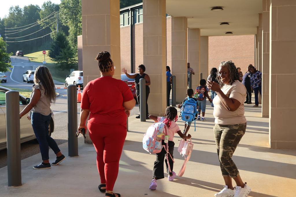 Grandparents greeting students in the morning carline
