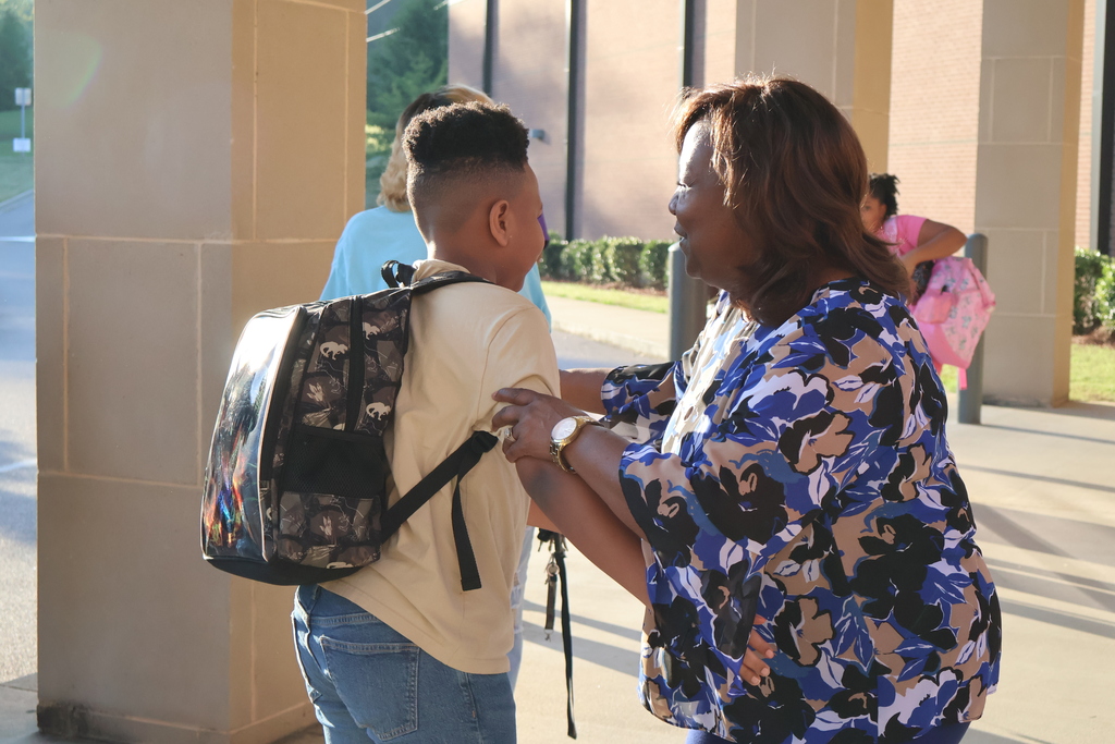 Grandparents greeting students in the morning carline