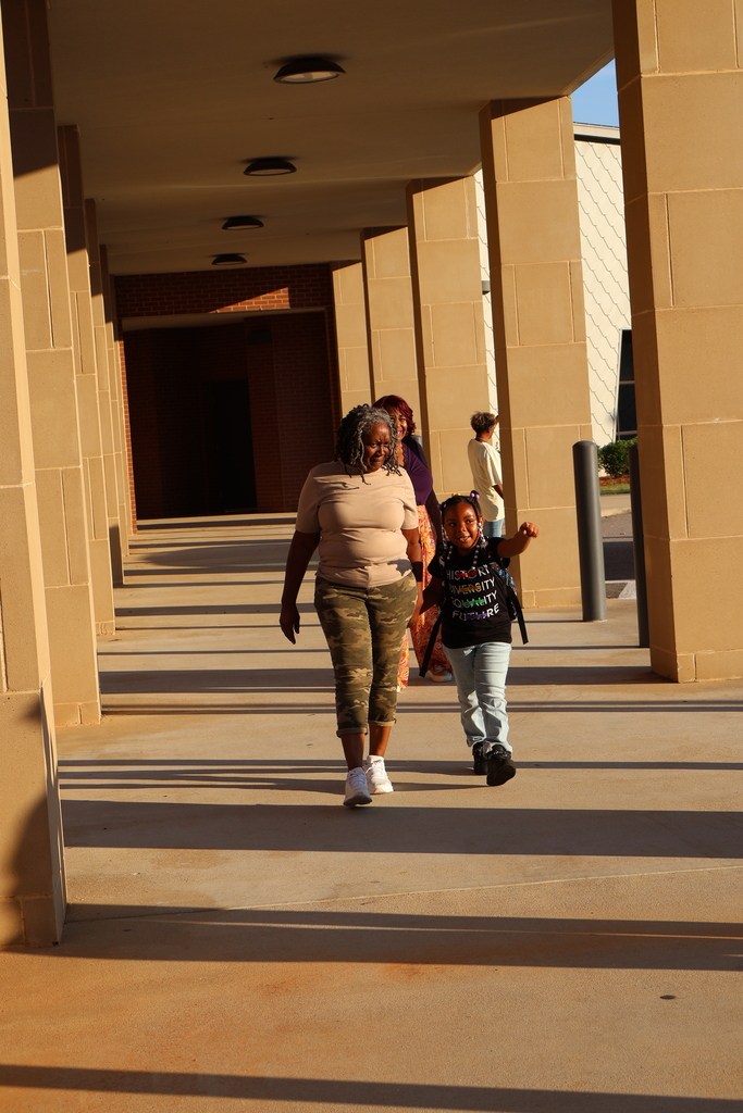 Grandparents greeting students in the morning carline