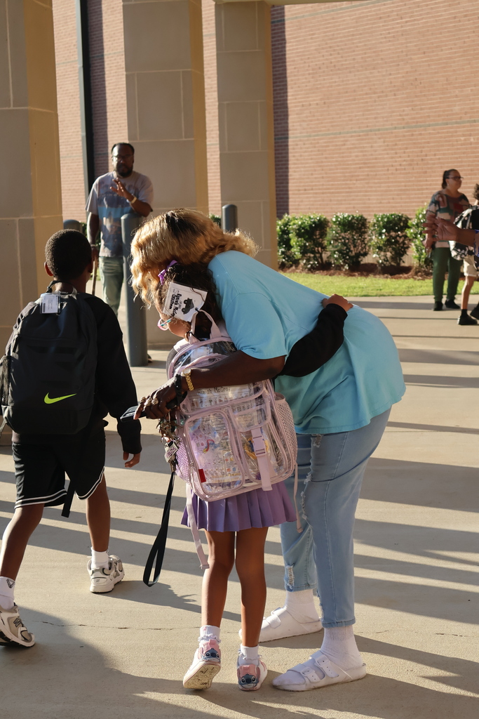 Grandparents greeting students in the morning carline