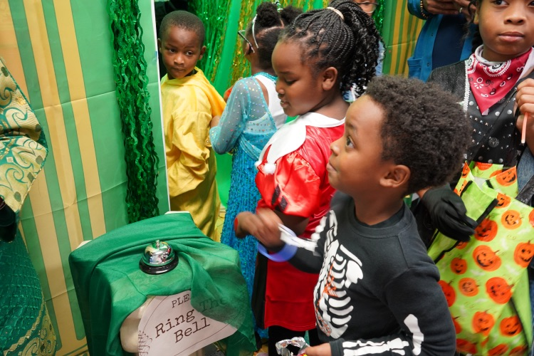 excited kids trick or treating