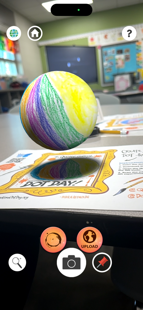 Students colored a picture of a dot and teaher scanned QR code on the paper to make a 3D version on their phone of the students dot. It is a screen shot of the teachers phone.