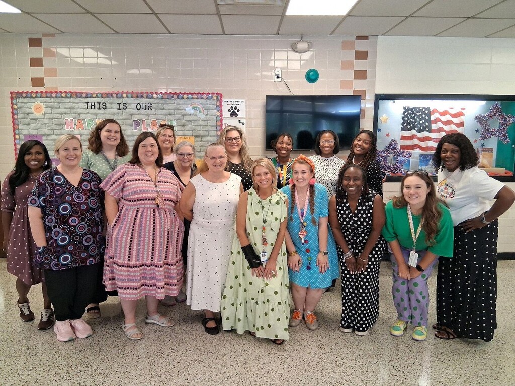 Brookville Elementary teachers and students smile for photos while wearing dots in celebration of National Dot Day.
