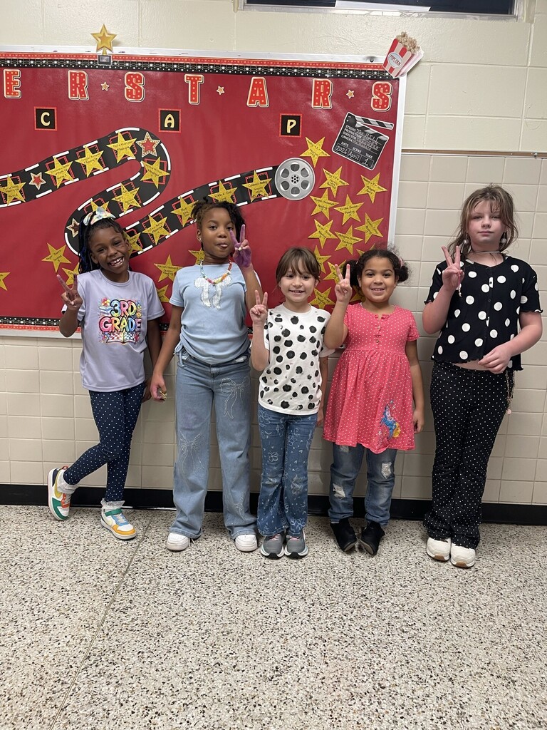 Brookville Elementary teachers and students smile for photos while wearing dots in celebration of National Dot Day.