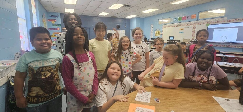 Brookville Elementary teachers and students smile for photos while wearing dots in celebration of National Dot Day.