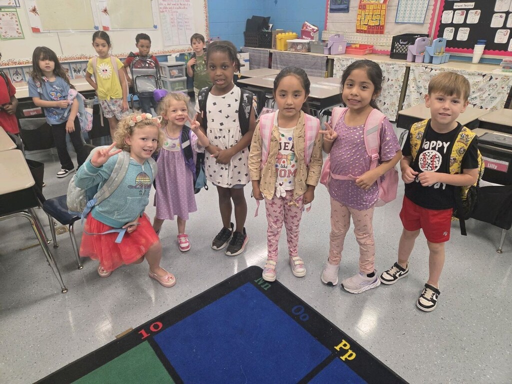 Brookville Elementary teachers and students smile for photos while wearing dots in celebration of National Dot Day.
