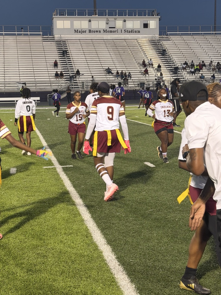 flag football players play flag football on a field