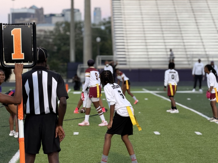 flag football players play flag football on a field