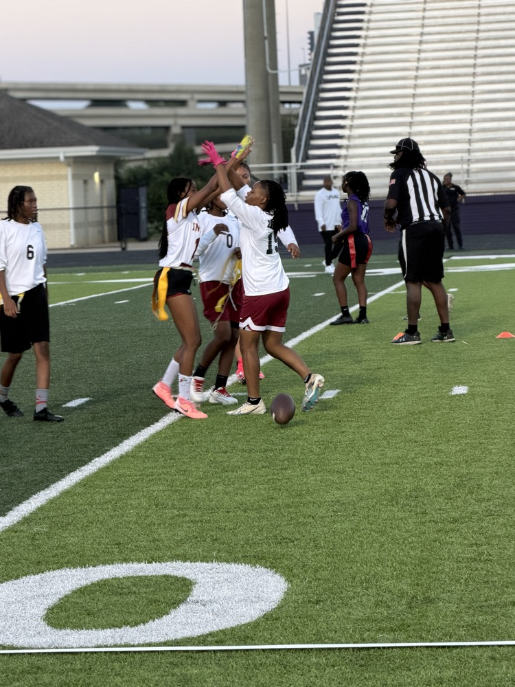 flag football players play flag football on a field