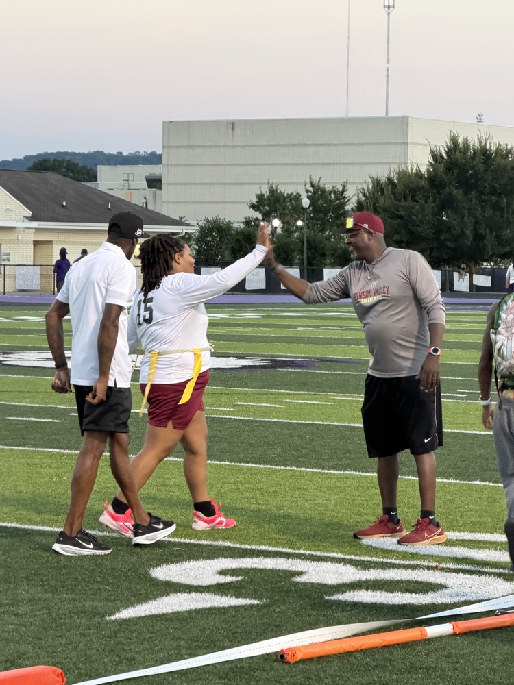 a play shakes hands with a coach