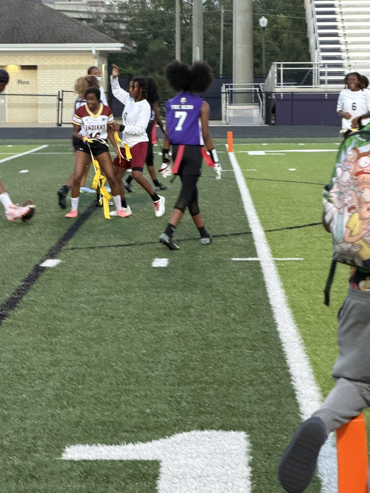 flag football players play flag football on a field