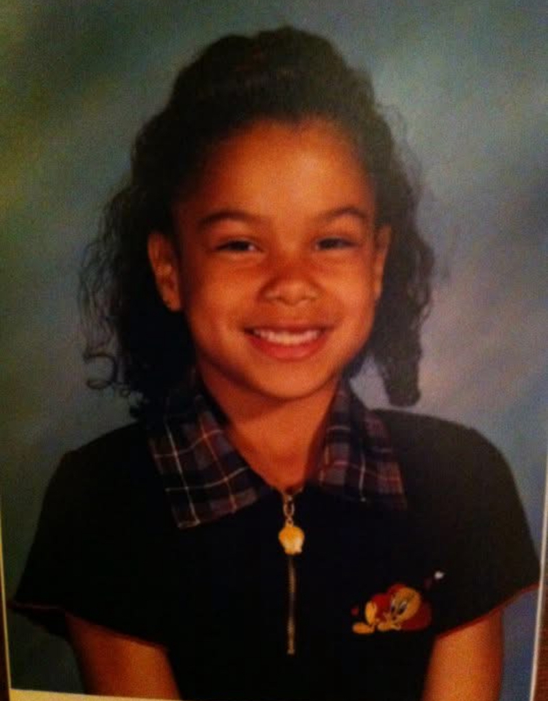A childhood school portrait of a McCalla Elementary teacher or staff member, shared as part of a fun Picture Day guessing game for families.