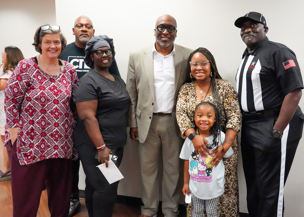 A group photo of attendees at Mr. Bobby Jackson's retirement party.