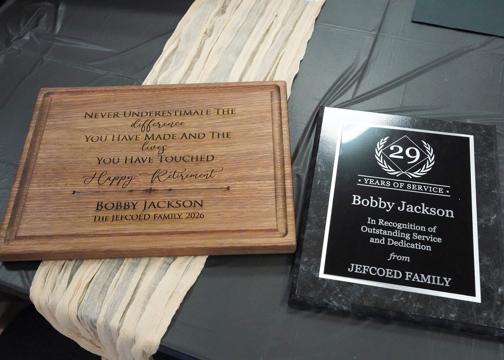 Two awards given to Bobby Jackson during his retirement party lay on the table.