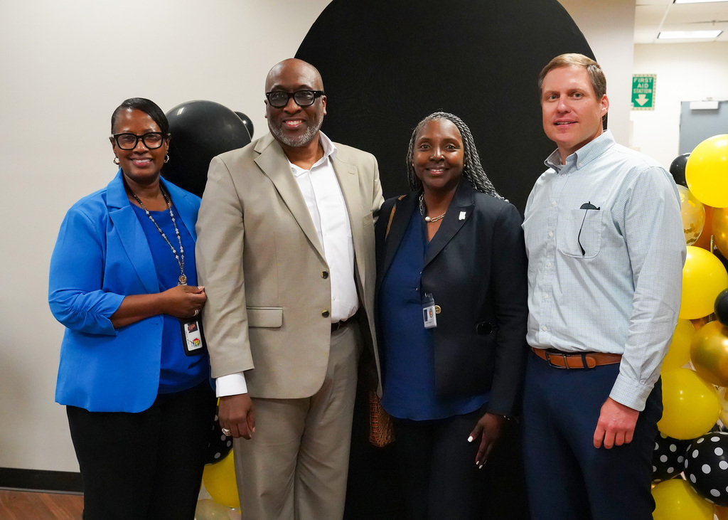 Mr. Bobby Jackson takes a group photo with members of the Alabama Department of education during his retirement party.