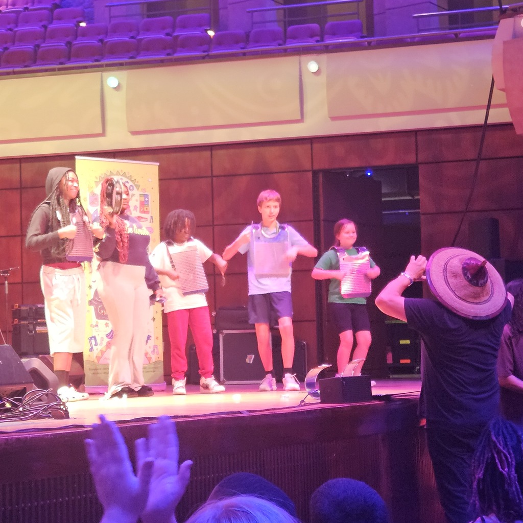 Students from different schools got to play frottoirs & tambourine on stage. 