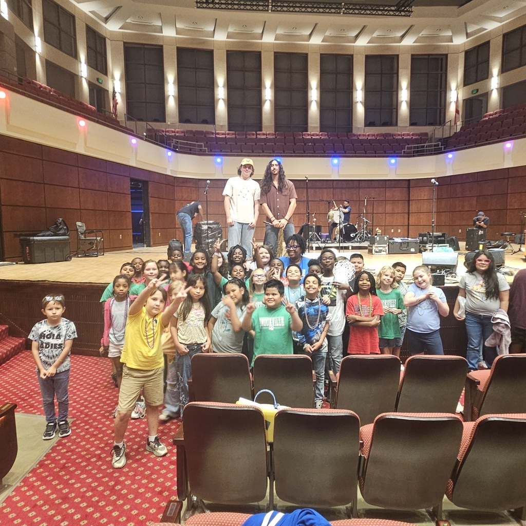 4th graders posing with Ms. Caldwell & two band members.. 