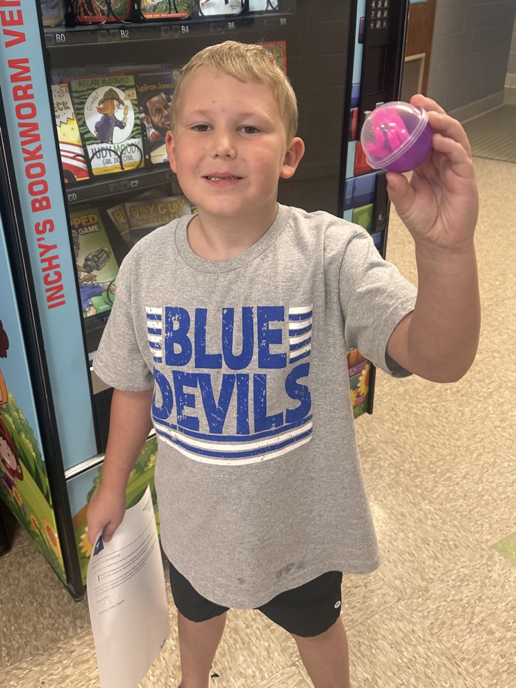 Boy smiling with a prize