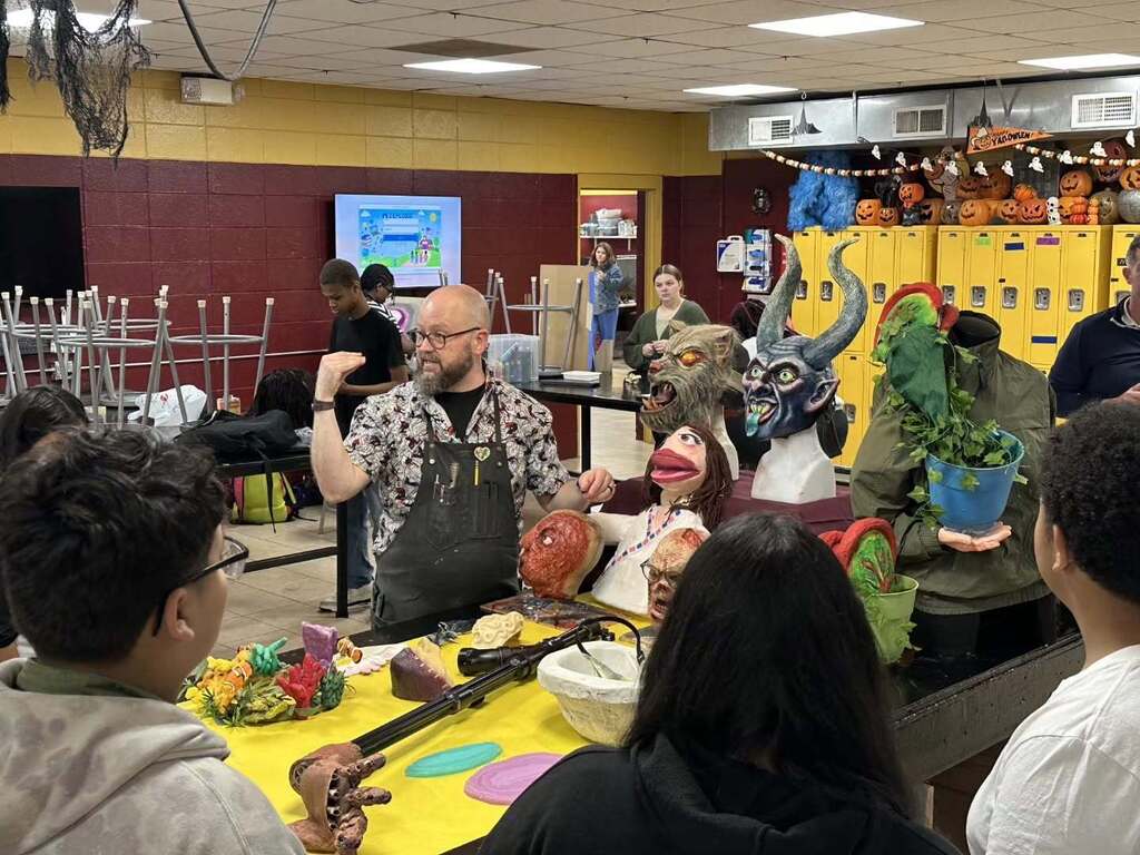 Pinson Valley High School's Special Effects teacher shows students a hand-made puppet in his classroom.
