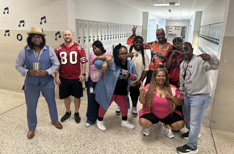 HMS faculty and staff show off their retro looks for Homecoming Decades Day.