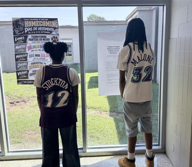 Two HMS students show their throwback Stockton and Malone basketball jerseys for Decades Day.