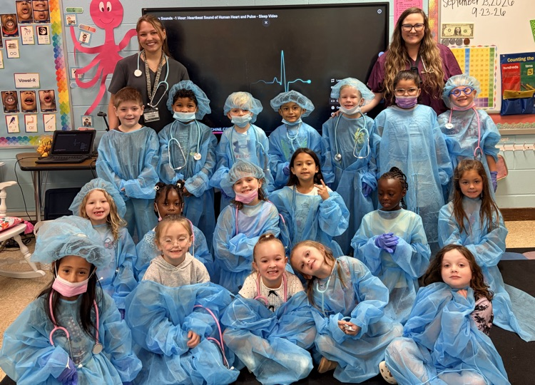 Mrs. Taylor, her student intern, and their class