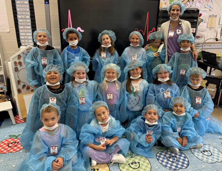 Mrs. Fowler and her little doctors posing