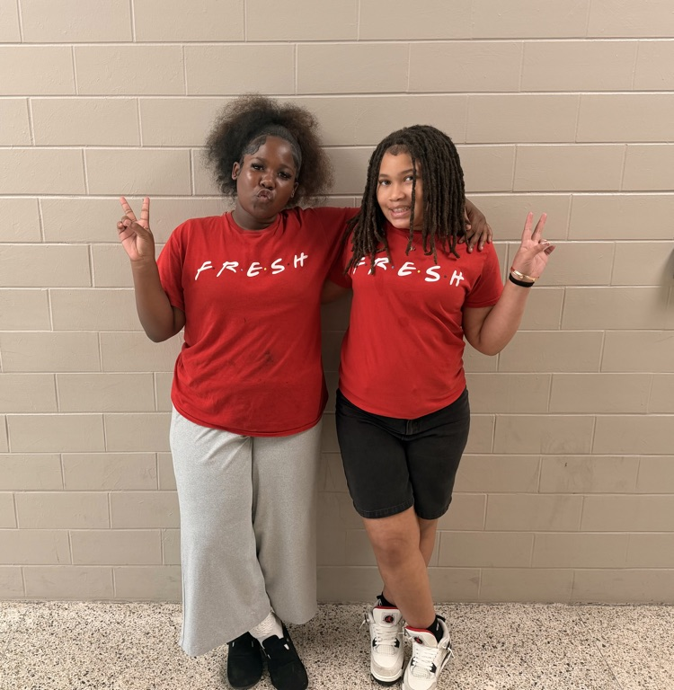 Two HMS students pose in matching red FRESH shirts for Two to Tango Day.